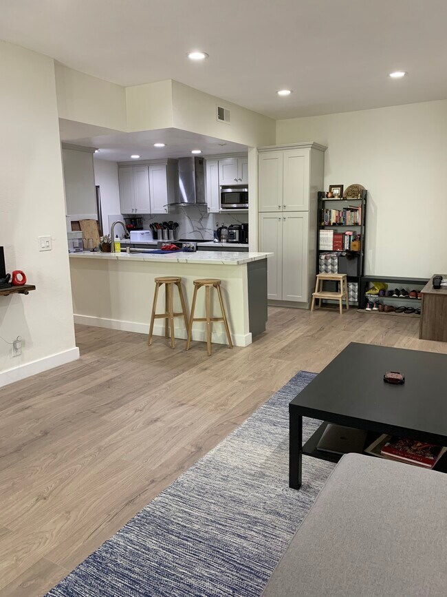 Spacious living room and open kitchen. - 6442 Buena Vista Dr