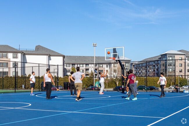 Kids having fun playing pickup basketball at Laurel Hill Park.