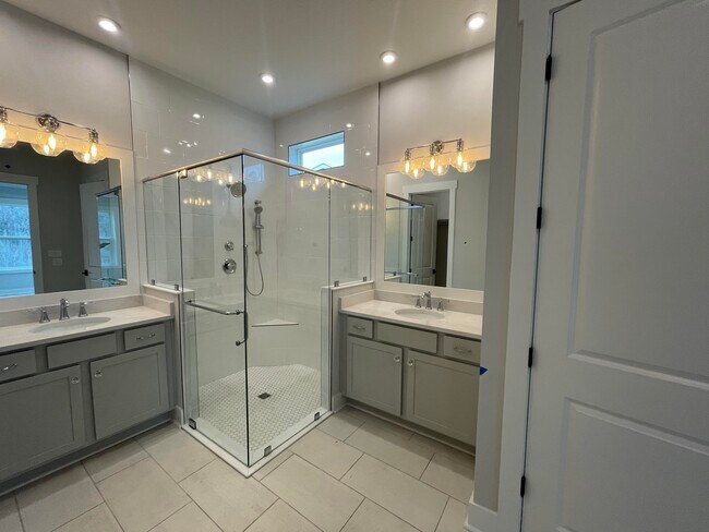 Master bath with his and her vanities and closet - 134 E Lafayette Rd
