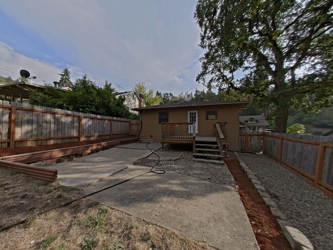 Building Photo - Charming bungalow with a large fence yard!