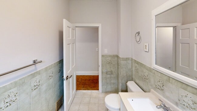 Building Photo - 9/1 No Fee! Renovated 3BR near Green Line w/balcony, free laundry