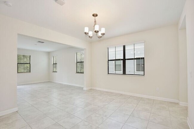 Foto del edificio - Beautiful 4/3.5 Townhome with a Spacious 2 Car Garage Located in Trails at Moss Park - Orlando