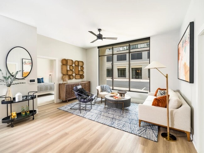 Bright and stylish, the living spaces at Modera Liberty Row feature expansive windows and refined finishes, creating a welcoming home in Charlotte. - Modera Liberty Row