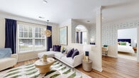 Located at 150 Coveside Lane in Chesapeake, Virginia, this thoughtfully designed one-bedroom, one-bathroom residence offers a comfortable and stylish single-floor layout. The living room is a standout space, showcasing warm hardwood flooring, crown molding, a decorative column, and an elegant arched pass-through that adds architectural character. Large windows dressed with navy drapes and white plantation blinds flood the room with natural light. A dedicated dining area sits adjacent to the living space, framed by a generous window overlooking lush greenery, creating a bright and inviting atmosphere. The galley-style kitchen is efficiently designed with white cabinetry, granite-look countertops, and stainless steel appliances, including a range, built-in microwave, and dishwasher, all set over hardwood floors. The primary bedroom offers a tranquil retreat, featuring a patterned accent wall, plush carpeting, and natural light through slatted blinds. The full bathroom includes a tub-shower combination, a wide vanity with ample cabinet storage, a well-lit mirror, and hardwood flooring. A dedicated laundry area houses a full-size washer and dryer with built-in shelving above. A separate closet provides additional storage, completing this well-appointed home.