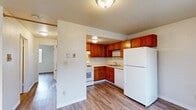 Located at 691 Tehama Ave, Unit 3, in Hayward, CA, this two-bedroom, one-bathroom unit offers a practical and well-organized single-floor layout. Wood-look laminate flooring runs throughout the entire space, providing a warm, cohesive aesthetic from room to room.

The kitchen features warm-toned wood cabinetry in an L-shaped configuration, complemented by white appliances including a gas range and full-size refrigerator. A built-in sink and ample cabinet storage make this an efficient cooking space. The kitchen opens directly to the adjacent living area, creating a connected, functional flow.

Both bedrooms are bright and simply designed, each featuring a large window that brings in natural light and views of the surrounding neighborhood. Built-in sliding panel closets with sleek white doors provide generous storage in both rooms, keeping the spaces clean and organized.

The bathroom is compact and efficiently arranged, featuring a combined shower and bathtub enclosed by a sliding glass door with chrome framing, a wood-cabinet vanity with an integrated sink, and wood-look flooring that maintains continuity with the rest of the unit.

Overall, the unit presents a clean, neutral palette with white walls and light trim throughout, offering a straightforward and livable space in a residential Hayward neighborhood.