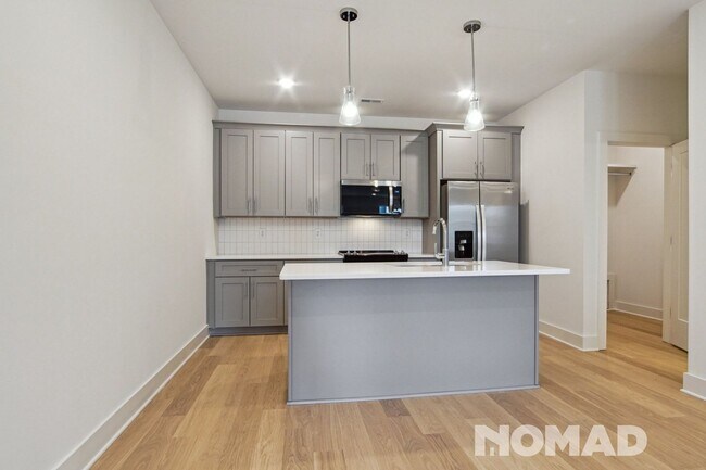Foto del edificio - Brand New three-story townhome offers a sp...
