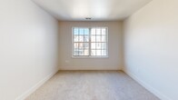 This 470 square foot apartment in Barrington, NJ, offers a well-designed living space with modern amenities. The single-floor layout comprises one bedroom, one bathroom, and an open-concept kitchen and living area. The kitchen showcases crisp white cabinetry, stainless steel appliances, and a sleek design that includes a washer-dryer unit for convenience. Warm wood flooring in the kitchen and living area contrasts beautifully with the neutral walls and cabinetry, creating a welcoming atmosphere. The bathroom features a tub-shower combination, white fixtures, and continues the wood flooring theme. The bedroom, measuring 110 square feet, is carpeted for comfort and includes a large window that allows natural light to flood the space. Throughout the apartment, recessed lighting and strategically placed windows enhance the sense of spaciousness. Despite its compact size, this apartment efficiently utilizes every square foot to provide a comfortable and stylish living environment.
