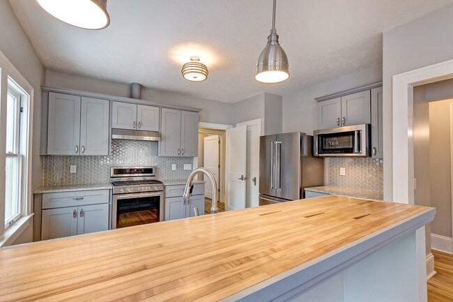 Kitchen with Bar - 2439 W 11th St