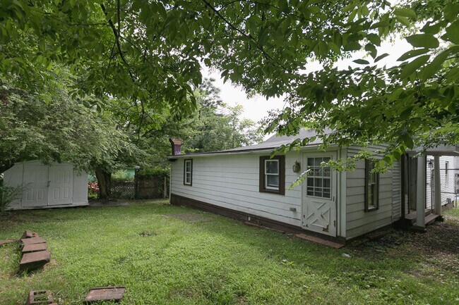 Foto del edificio - Four-Bedroom Bungalow with Fenced Yard Near Downtown Durham!