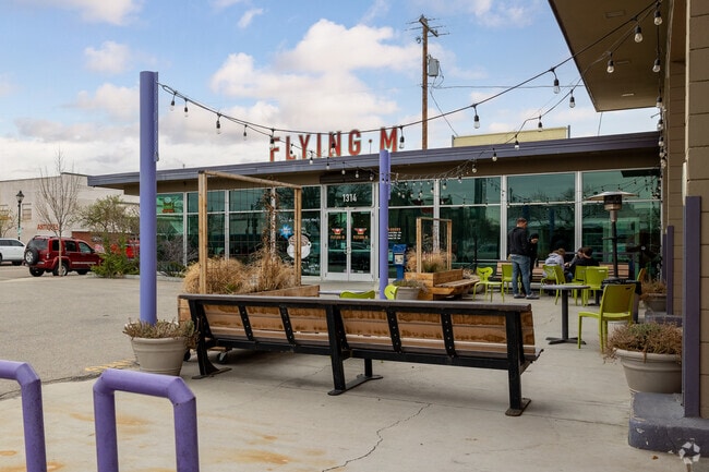 Enjoy Your Freshly Brewed Coffee on the Outdoor Patio at the Flying M Coffee Garage.