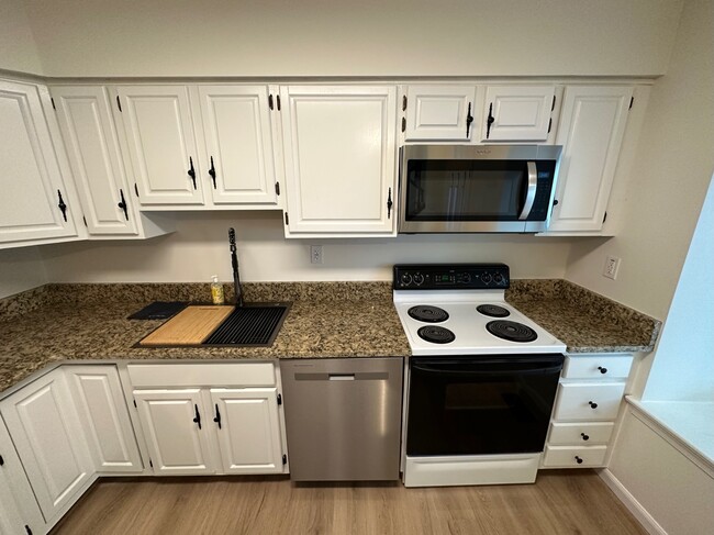 New countertop, sink, dishwasher, and externally vented microwave - 313 Milford Ct