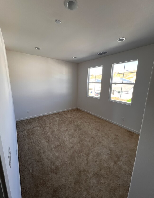 This image shows the room with the picture taken from the entrance door - 18122 Radiance Ln