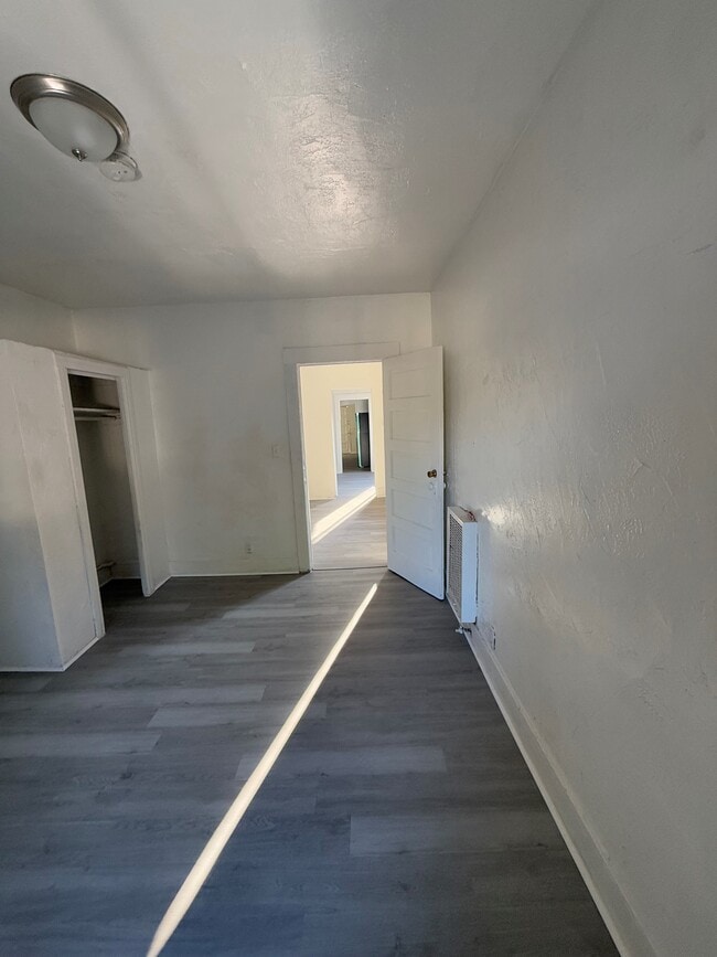 Primary bedroom with view to rest of apartment - 1929 Daly St
