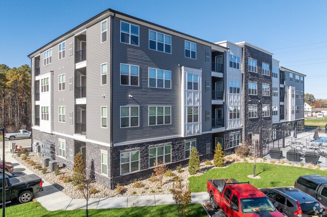 Building Photo - Camelot on Main Street - Brand New!