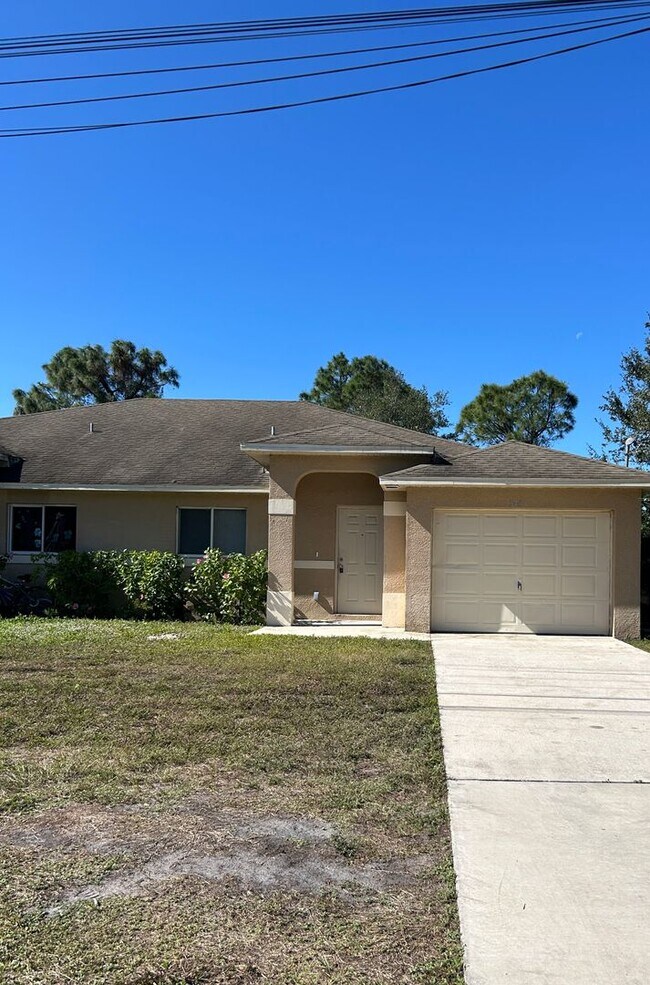 Building Photo - Charming 3BR/2BA Lehigh Acres Duplex with 1-Car Garage | Lawn Care & Salt Service Included