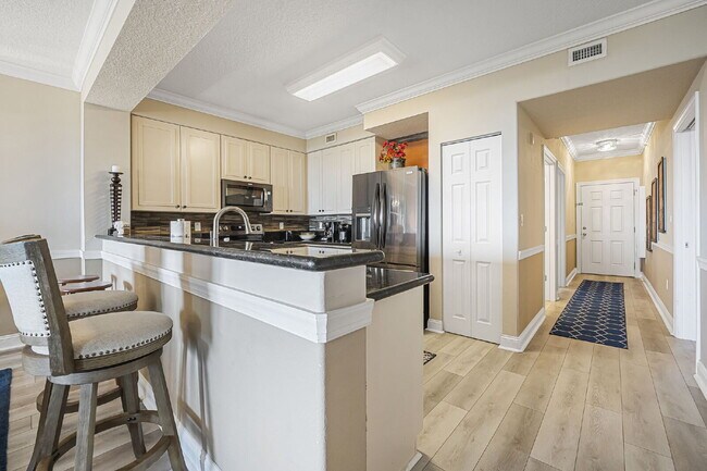 Building Photo - Available for a 7-12 month lease, Unit 208 has a beautiful oceanfront setting.