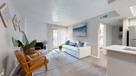 Located at 2317 Southern Oak Dr in Arlington, TX, this one-bedroom, one-bathroom unit offers an efficiently designed single-floor layout with a practical flow between each room. Light wood-style flooring runs throughout the space, contributing to a clean and cohesive aesthetic.

The living room serves as the central gathering area, highlighted by a white diagonal-paneled fireplace surround that adds a distinctive architectural touch. A sliding glass door with vertical blinds fills the room with natural light and provides access to the outdoors. The space connects seamlessly to the kitchen and bedroom via a short hallway.

The kitchen features stainless steel appliances, including a full-size refrigerator, microwave, and range. White cabinetry and a light countertop with an undermount sink offer a functional and tidy workspace.

The bedroom accommodates a full-size bed comfortably and benefits from a window that brings in additional natural light and outdoor views. The bathroom includes a tub-shower combination with white tile surround, maintaining the unit's clean, neutral palette.

A textured ceiling is consistent throughout, and the overall ambiance is bright, neutral, and well-suited for comfortable everyday living.