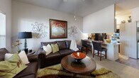 Located at 800 SW 19th St in Moore, Oklahoma, this one-bedroom, one-bathroom unit offers an efficient and well-organized single-floor layout. The open-concept living room and kitchen area serves as the heart of the home, maximizing the use of available space. The living area features a ceiling fan, textured ceilings, carpet flooring, and windows that invite natural light while offering views of the surrounding exterior. A compact dining bar connects the living space to the kitchen, which is equipped with a stainless steel range, built-in microwave, light wood cabinetry, and light-toned countertops, with wood-style flooring underfoot. The bedroom is a comfortable retreat, featuring plush carpet, a ceiling fan, and multiple windows that bring in abundant natural light with views of the outdoors. A dedicated closet provides practical storage. The bathroom includes a full tub and shower combination enclosed by sliding glass doors, complemented by wood-style flooring and clean, neutral finishes. Throughout the unit, neutral wall tones and consistent design elements create a cohesive and functional living environment well-suited for individuals or couples seeking a practical residence in Moore, Oklahoma.
