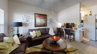 Located at 800 SW 19th St in Moore, Oklahoma, this one-bedroom, one-bathroom unit offers an efficient and well-organized single-floor layout. The open-concept living room and kitchen area serves as the heart of the home, maximizing the use of available space. The living area features a ceiling fan, textured ceilings, carpet flooring, and windows that invite natural light while offering views of the surrounding exterior. A compact dining bar connects the living space to the kitchen, which is equipped with a stainless steel range, built-in microwave, light wood cabinetry, and light-toned countertops, with wood-style flooring underfoot. The bedroom is a comfortable retreat, featuring plush carpet, a ceiling fan, and multiple windows that bring in abundant natural light with views of the outdoors. A dedicated closet provides practical storage. The bathroom includes a full tub and shower combination enclosed by sliding glass doors, complemented by wood-style flooring and clean, neutral finishes. Throughout the unit, neutral wall tones and consistent design elements create a cohesive and functional living environment well-suited for individuals or couples seeking a practical residence in Moore, Oklahoma.