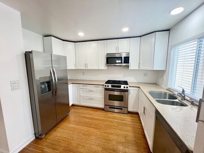 Foto del edificio - Stunning 4BR Townhome with Hardwood Floors, Private Patio, Community Pool & 2-Car Garage!
