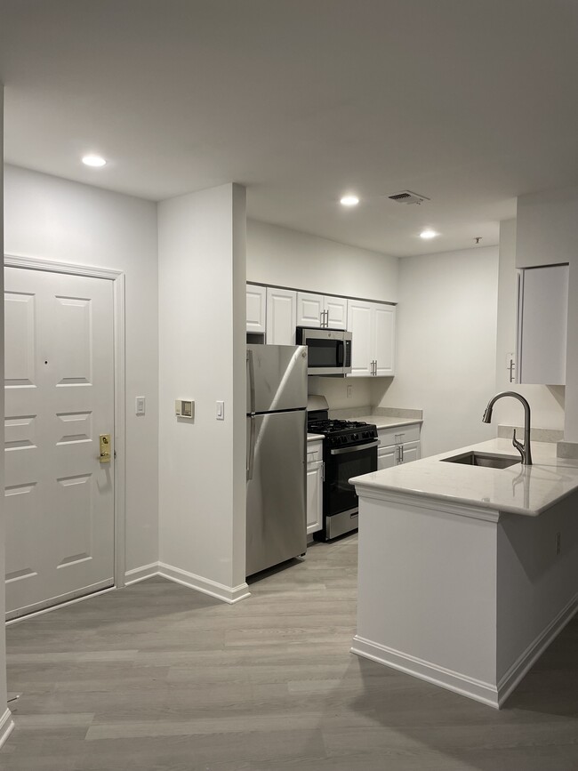 Kitchen with Granite Countertops and Stainless Steel Appliances - 12913 Alton Sq