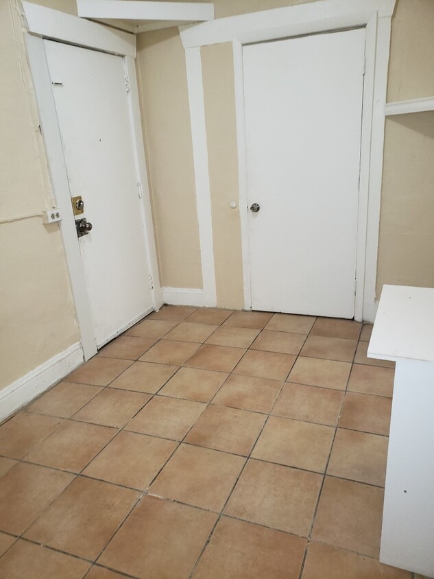 Living space w/ door to bedroom - 2110 W Flagler St