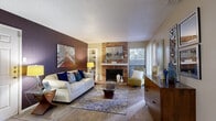 This thoughtfully designed 1-bedroom, 1-bathroom residence offers a comfortable and functional single-floor layout. The open-concept living room serves as the heart of the home, showcasing rich wood-look flooring, a striking textured brick fireplace, and built-in shelving. A bold accent wall in deep plum adds visual depth, while a large window invites natural light and views of the surrounding greenery, creating a warm and inviting atmosphere.

The kitchen features dark espresso cabinetry, granite-style countertops, a stainless steel refrigerator, and a double-basin sink. It flows seamlessly into the living and dining areas, making the space ideal for everyday living. A dedicated laundry room with a full-size washer and dryer adds everyday convenience rarely found in similarly sized residences.

The bedroom offers a cozy retreat with plush carpeting, a large window with outdoor views, and a closet for ample storage. The full bathroom is well-appointed with a tub/shower combination, dark cabinetry with granite-style countertops, wood-look flooring, and a teal accent wall that adds a pop of color. Throughout the residence, textured ceilings and neutral wall tones create a cohesive, comfortable living environment.