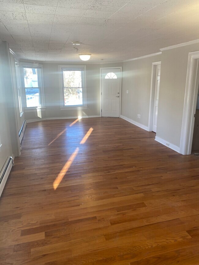 Living/dining room towards street - 90 Cottage St
