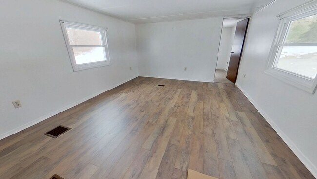 Building Photo - First-Floor Living with Private Wooded Backyard Setting