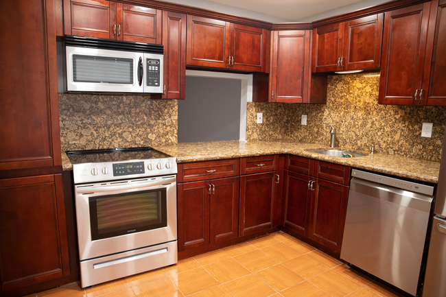 Kitchen (2nd Floor): Pass through access to living room and plenty of cabinet space - 9890 Hammocks Blvd