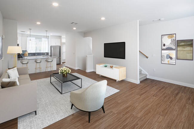 Phase II Renovated Package I townhome living and dining area with hard surface flooring - Avalon Acton