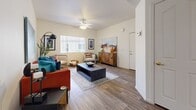 Located at 13621 W Glendale Ave in Glendale, Arizona, this 2-bedroom, 1-bathroom single-story home offers a well-organized layout that maximizes every square foot. Wood-look flooring runs throughout the space, creating a cohesive and easy-to-maintain foundation across all rooms.

The living room serves as the central gathering area, featuring a ceiling fan, a large window that draws in natural light, and open sight lines toward the kitchen and hallway. The kitchen is equipped with light wood cabinetry, white countertops, and a dishwasher. A dedicated in-unit laundry area with a full-size washer and dryer is conveniently positioned adjacent to the kitchen, complete with overhead shelving for storage.

The primary bedroom is a comfortable retreat featuring vaulted ceilings, a ceiling fan, a mirrored sliding-door closet with gold-tone hardware, and a window with vertical blinds. The second bedroom offers a similarly bright and airy feel, with its own window, ceiling fan, and a standard closet with paneled doors.

The bathroom is clean and functional, offering a shower-tub combination, a single-sink vanity with warm wood cabinetry, and wood-look flooring that ties back to the rest of the home. Overall, the space presents a bright, neutral palette that provides a versatile and welcoming environment.