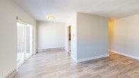 Located at 75 Mary St in Chatham-Kent, Ontario, this one-bedroom, one-bathroom unit offers a well-organized single-floor layout designed for comfortable everyday living. The open-concept living, dining, and kitchen area forms the heart of the space, finished with light wood-look flooring and neutral warm-toned walls that create a clean, welcoming atmosphere throughout. Large windows and a sliding glass door flood the living area with natural light and provide direct access to a private balcony with outdoor views, enhancing the sense of openness. The kitchen is equipped with stainless steel appliances, including a full-size refrigerator and range, set against light-toned cabinetry and tile flooring. The bedroom offers a cozy and functional retreat, featuring the same light wood flooring, crisp white baseboards, and a closet with a sliding door. Baseboard heating is present throughout the unit. The bathroom is finished with classic white subway tile surrounding a full soaker tub and shower combination, complemented by chrome fixtures for a timeless, clean look. Overall, the unit presents a bright, move-in ready space with a simple and practical design suited for single occupants or couples in the heart of Chatham-Kent.