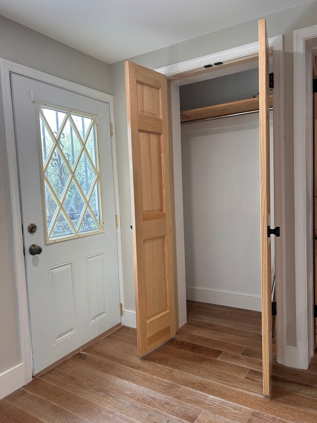Front door and coat closet - 300 Falcon Ln