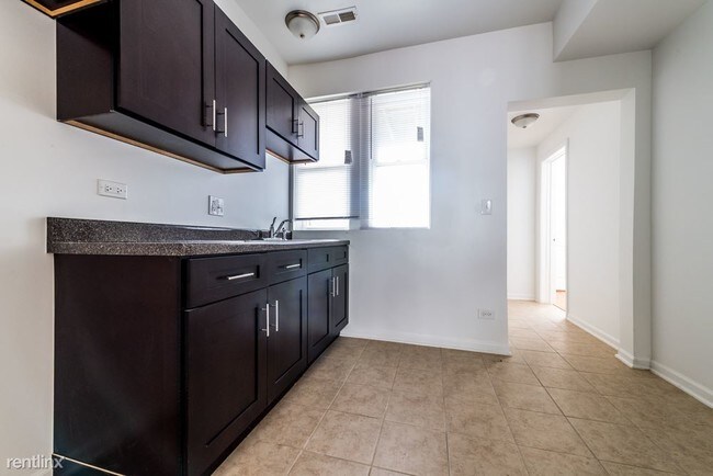 Foto del edificio - 7406 S Perry Ave