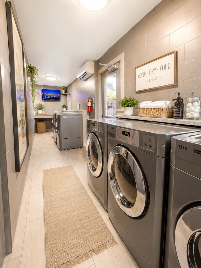 Complimentary luxury laundry center with commercial LG w/d - Marquee Uptown & Carriage Square