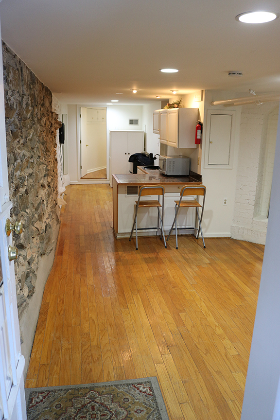 View from front door of apartment, living room, kitchenette, extra space, doorway to bedroom - 3118 Dumbarton St NW