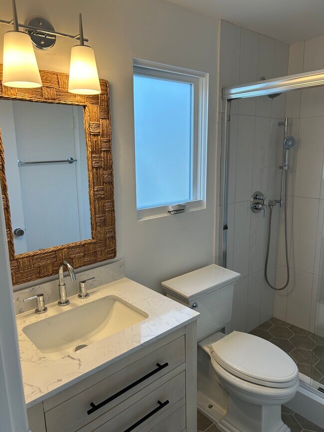 Bathroom w/new vanity, toilet, shower & accessories - 313 Sapphire Ave