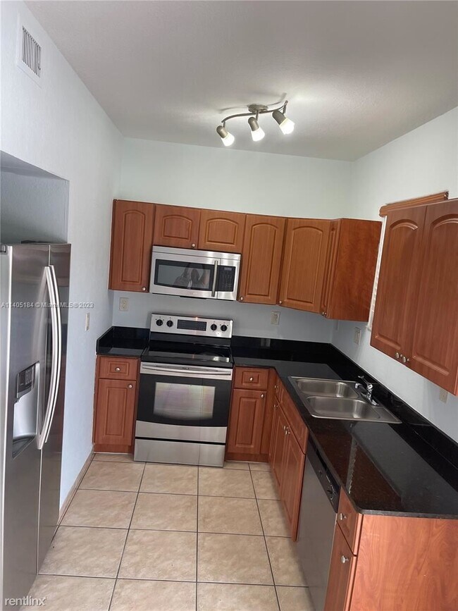 Building Photo - 3 br, 2.5 bath House - 7380 NW 174th Ter A...