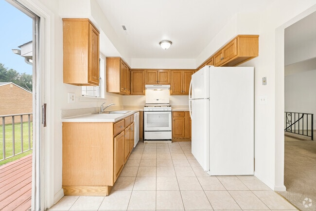 2BR, 1BA w/ Balcony - 1,230SF - Kitchen - Carriage Run Apartments & Townhomes