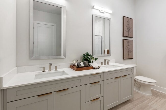 Stylish, spa-inspired bathrooms with framed mirrors and dual vanities available - The Residence Peninsula Apartments