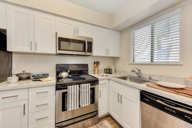 Kitchen with White Cabinets - Silverstone Apartments