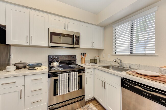 Kitchen with White Cabinets - Silverstone Apartments