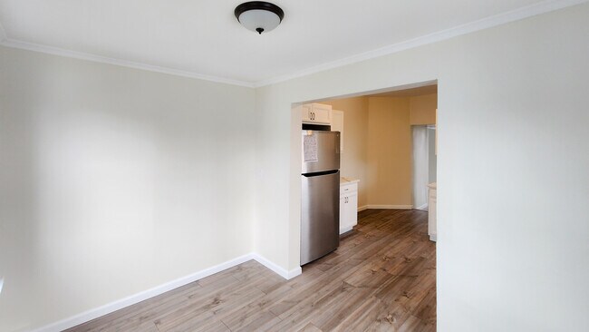 Looking into kitchen from sunroom/dining area. - 149 McClean Ave