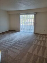 Living room  2nd/3rd floor with balcony - Windsor Gardens Apartments