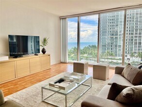 Building Photo - 10275 Collins Ave