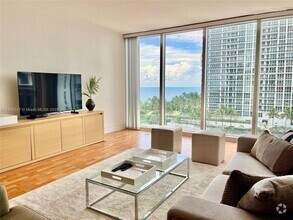 Building Photo - 10275 Collins Ave