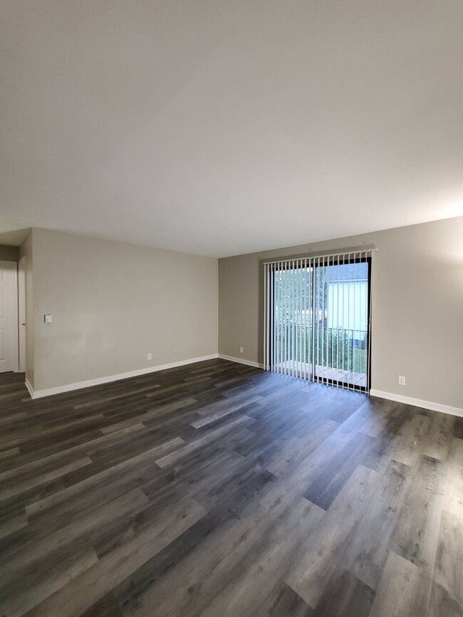 Living Room with walk-out Patio with view of River - 818 S 3rd Ave