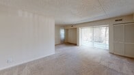 This 540 square foot one-bedroom apartment in Wilmington, Delaware offers a spacious and bright living environment. The open-plan layout maximizes the use of space, creating a seamless flow between the living and sleeping areas. Large windows and a sliding glass door flood the apartment with natural light, enhancing the sense of openness.

The neutral color palette, primarily featuring white walls and beige carpeting, provides a blank canvas for personal decorating styles. The textured ceiling adds a subtle architectural detail. The apartment includes a separate bedroom area, likely with a closet for storage.

A notable feature is the sliding glass door, which may lead to a small balcony or patio, offering potential outdoor space. The bathroom, while not fully visible in the images, appears to have modern fixtures and finishes.

The apartment's layout and size make it well-suited for single occupants or couples looking for a comfortable living space in an urban setting. The open design allows for flexible furniture arrangements to suit various lifestyle needs.