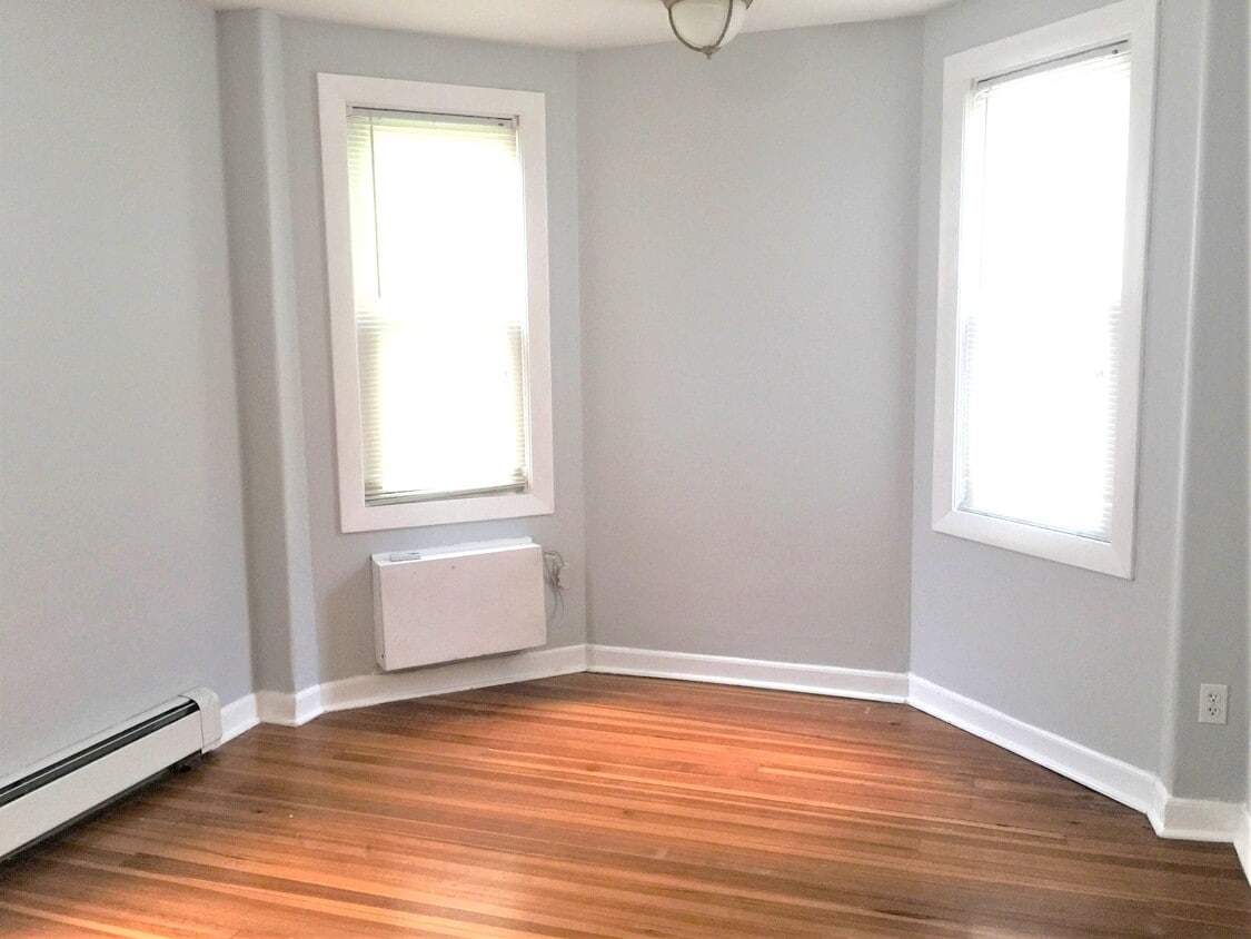 light-filled bedroom with A/C - 142 Humboldt Ave